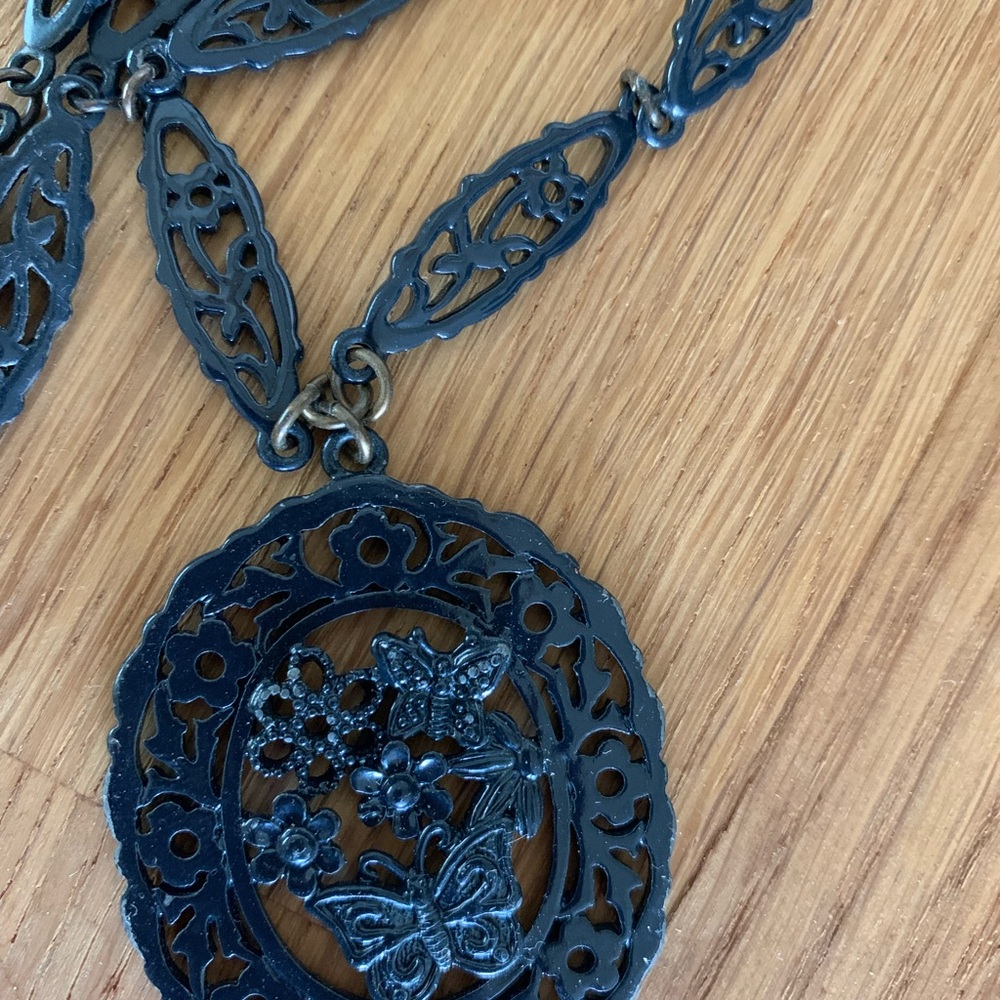 French Connection Black Metal Floral Filigree Oval Pendant Necklace